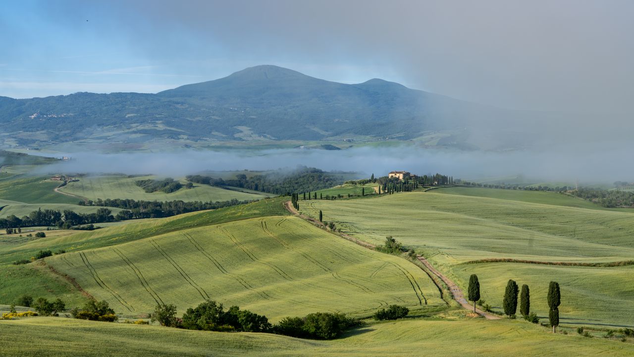 Beautiful landscape of rolling hills in San Quirico d'Orcia, Tuscany, Italy.